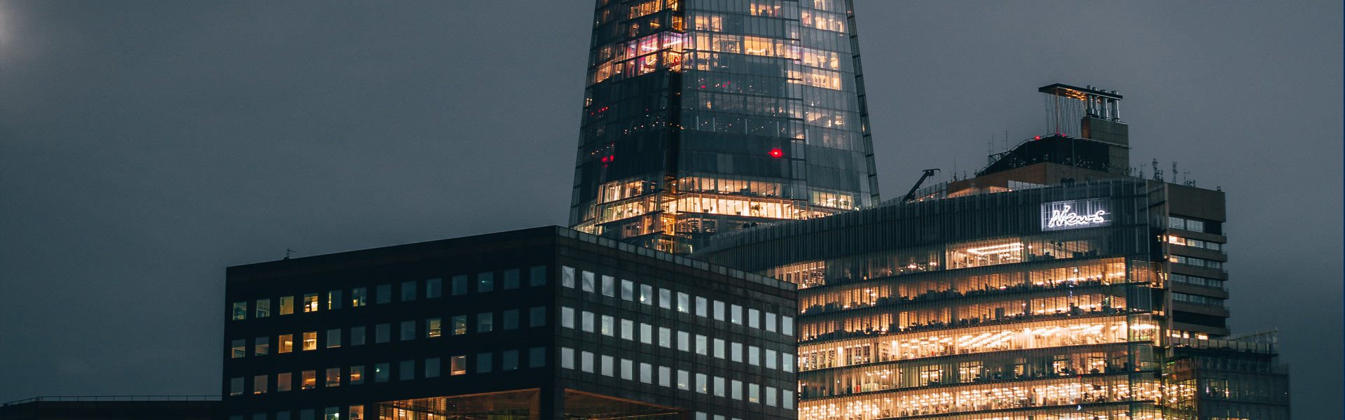 The Shard London with other building infront